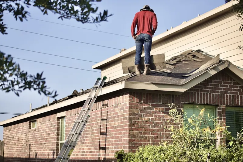 Professional roofer working on a residential roof in Orangevale